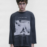Grey shirt worn by a person, showing the shirt fit