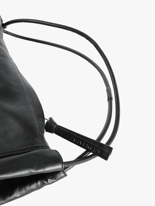 Close up of balck bag, showing texture of the leather fabric