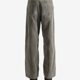 Brown pants worn by a person, showing the pants' fit