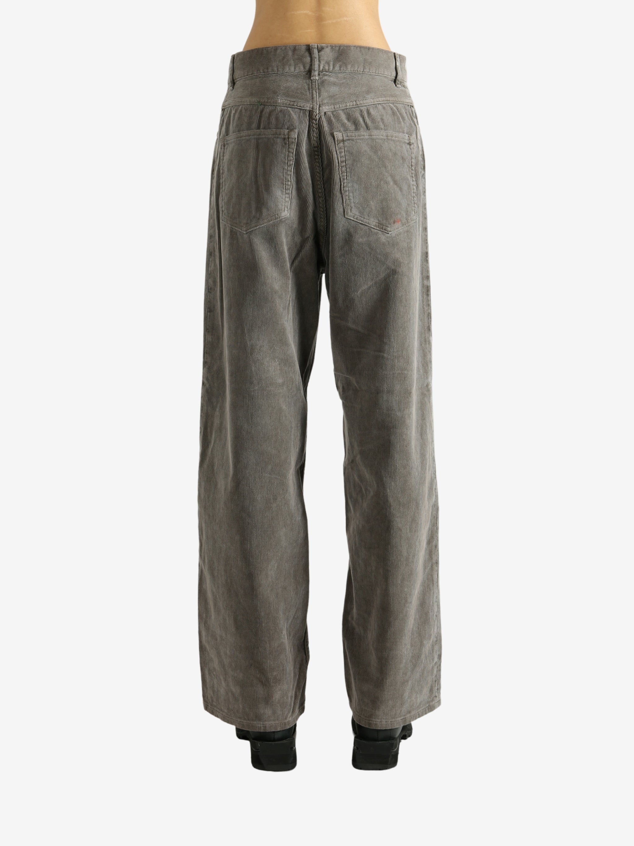 Brown pants worn by a person, showing the pants' fit