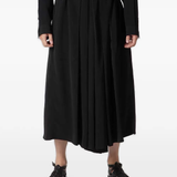 black pants,worn by a person, showing the pants fit