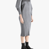 Grey dress worn by a person, showing the dress's fit