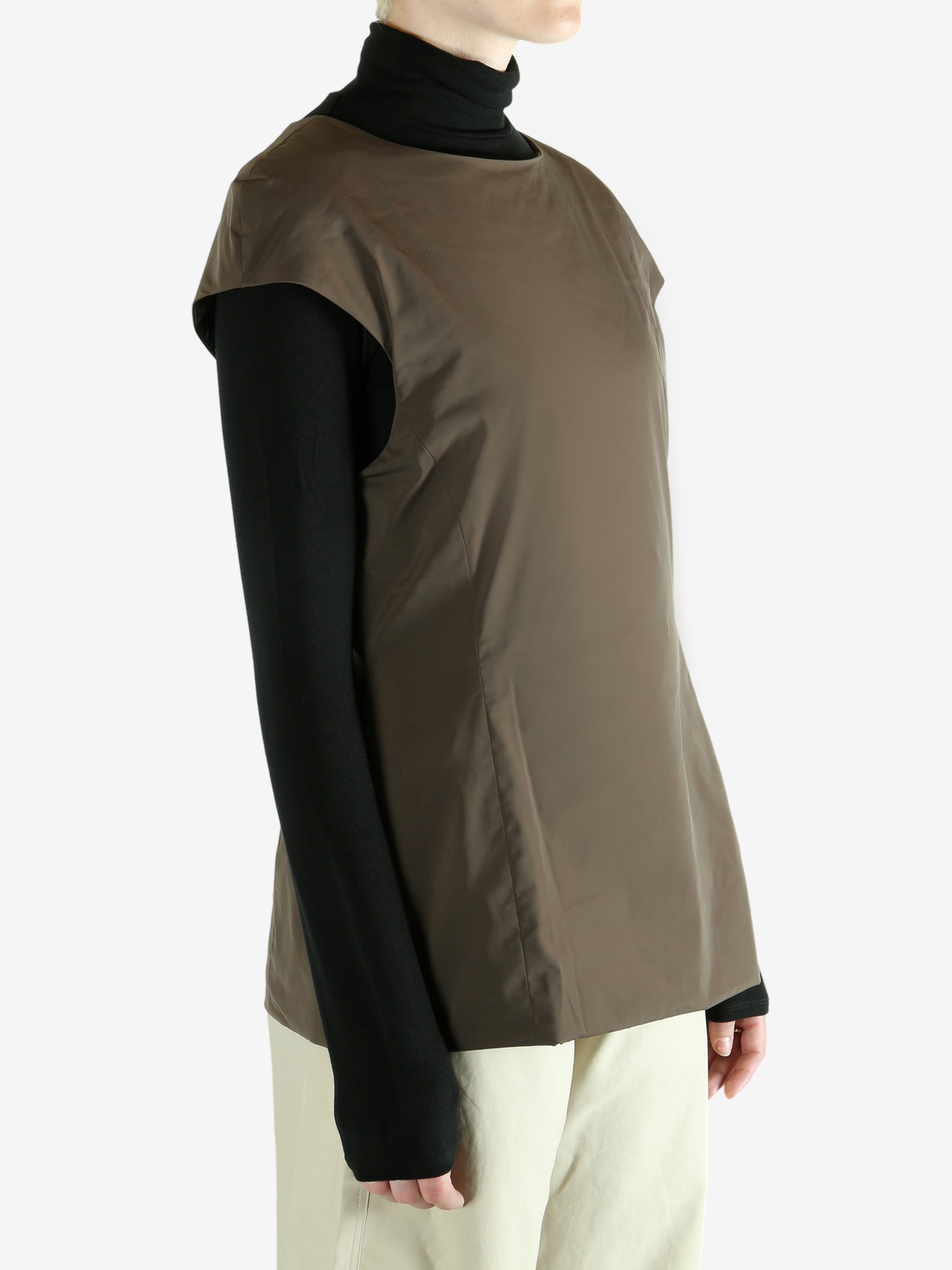 Brown dress worn by a person, showing  the dress's fit