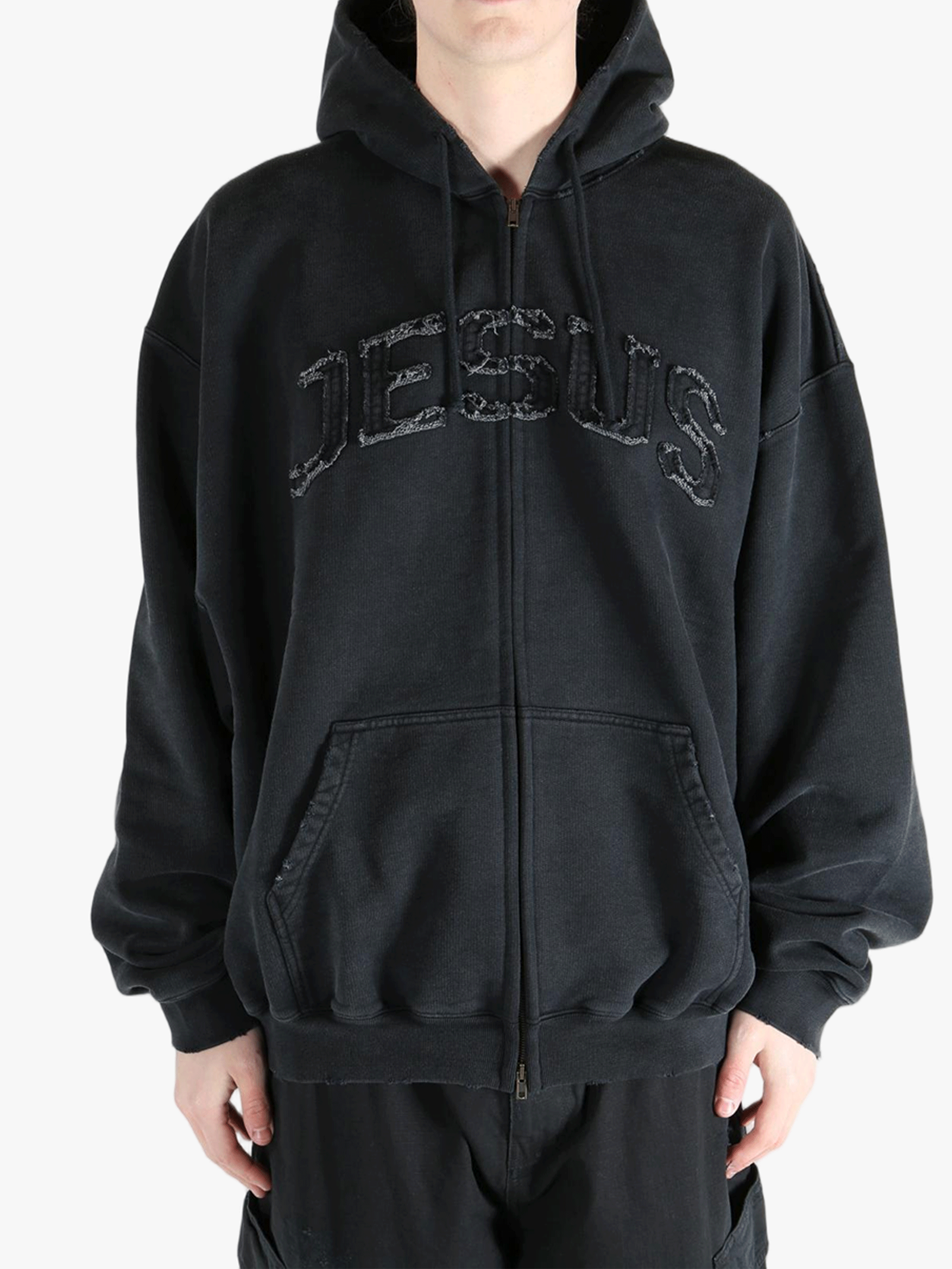 Black hoodie worn by a person, showing the hoodie fit