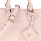 Close up of pink bag, showing texture of the leather fabric