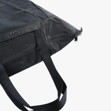 Close up of black bag, showing texture of the nylon fabric