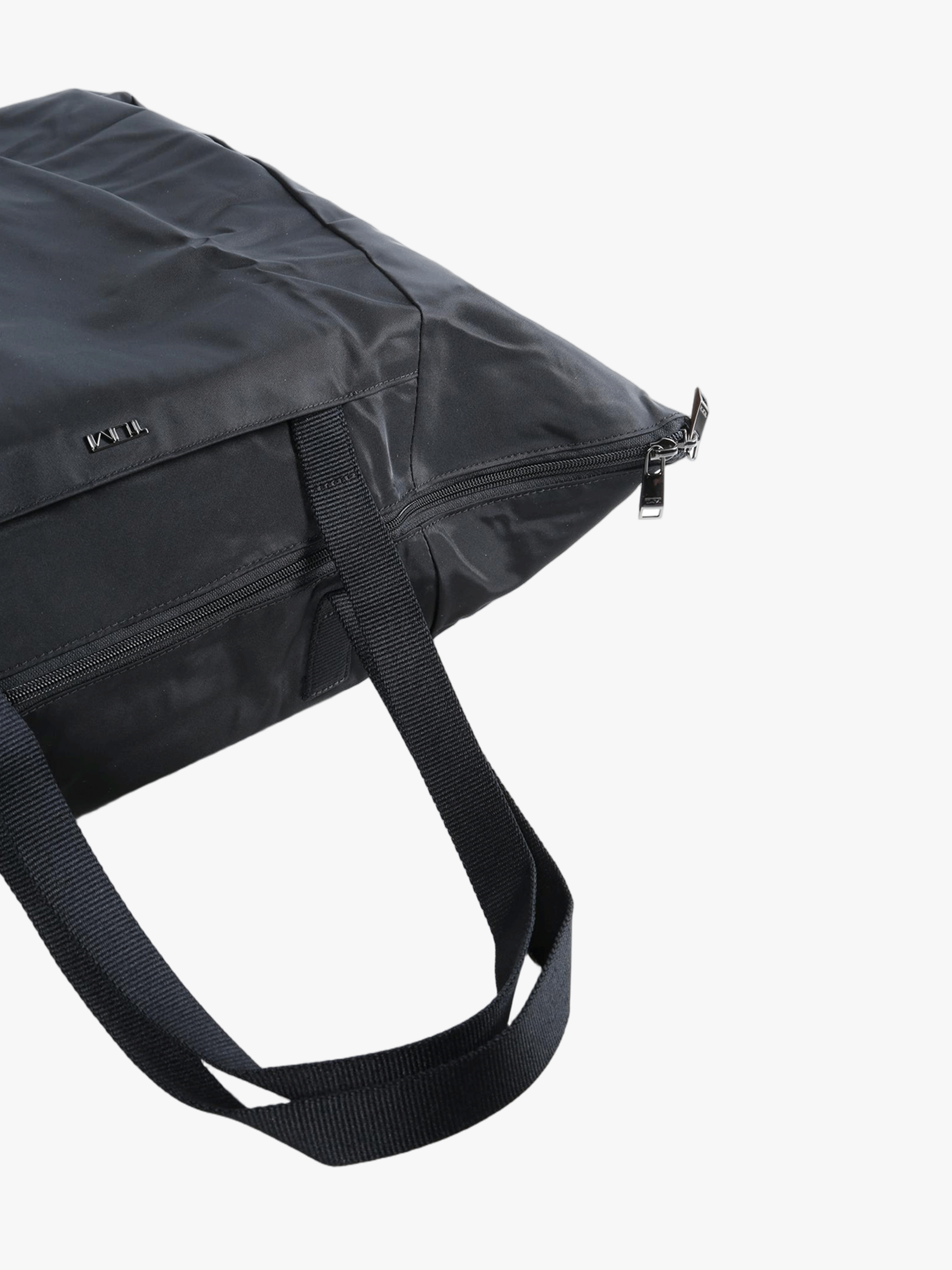 Close up of black bag, showing texture of the nylon fabric