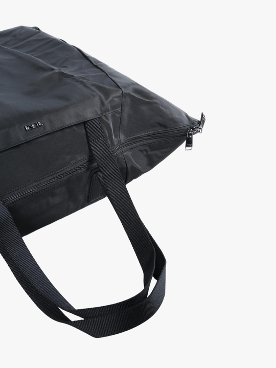 Close up of black bag, showing texture of the nylon fabric