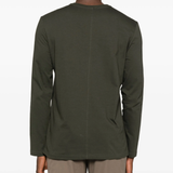 Green t-shirt worn by a person, showing the t-shirt fit