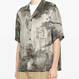 Grey shirts worn by a person, showing the shirts fit