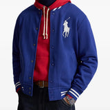 Blue jacket worn by a person, showing the jacket fit