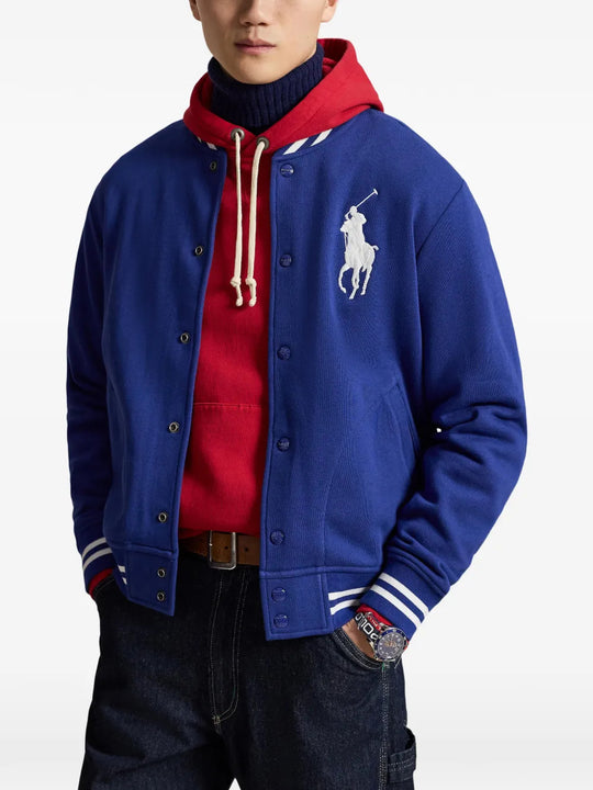 Blue jacket worn by a person, showing the jacket fit