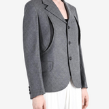 Grey jacket worn by a person, showing the jacket fit
