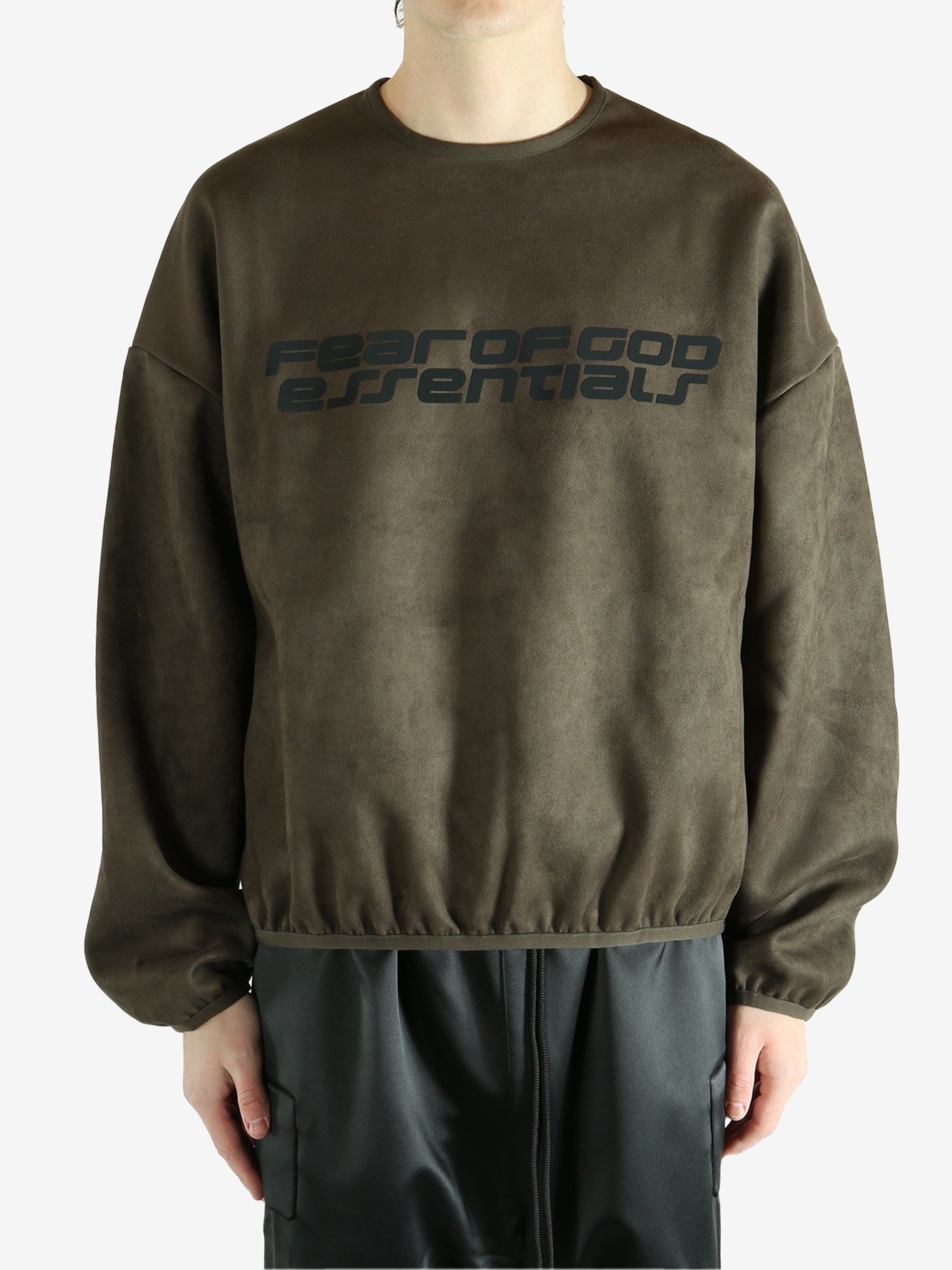 Brown sweatshirt worn by a person, showing the sweatshirt's fit