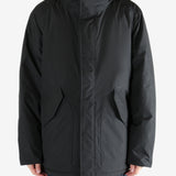 Black coat worn by a person,showing the coat fit