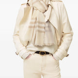 Tan scarf worn by a person, showing the scarf fit