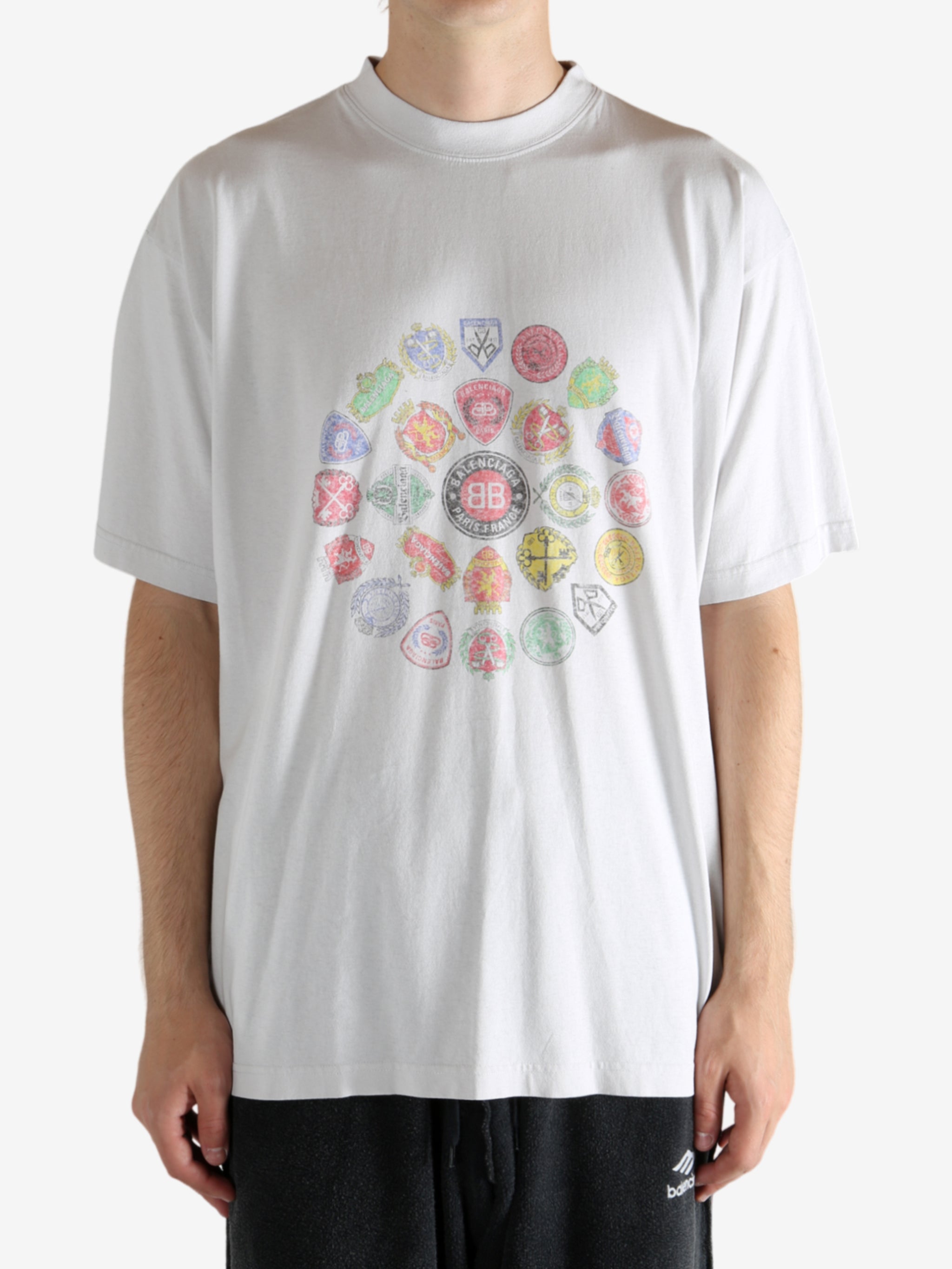 White t-shirt worn by a person, showing the t-shirt's fit