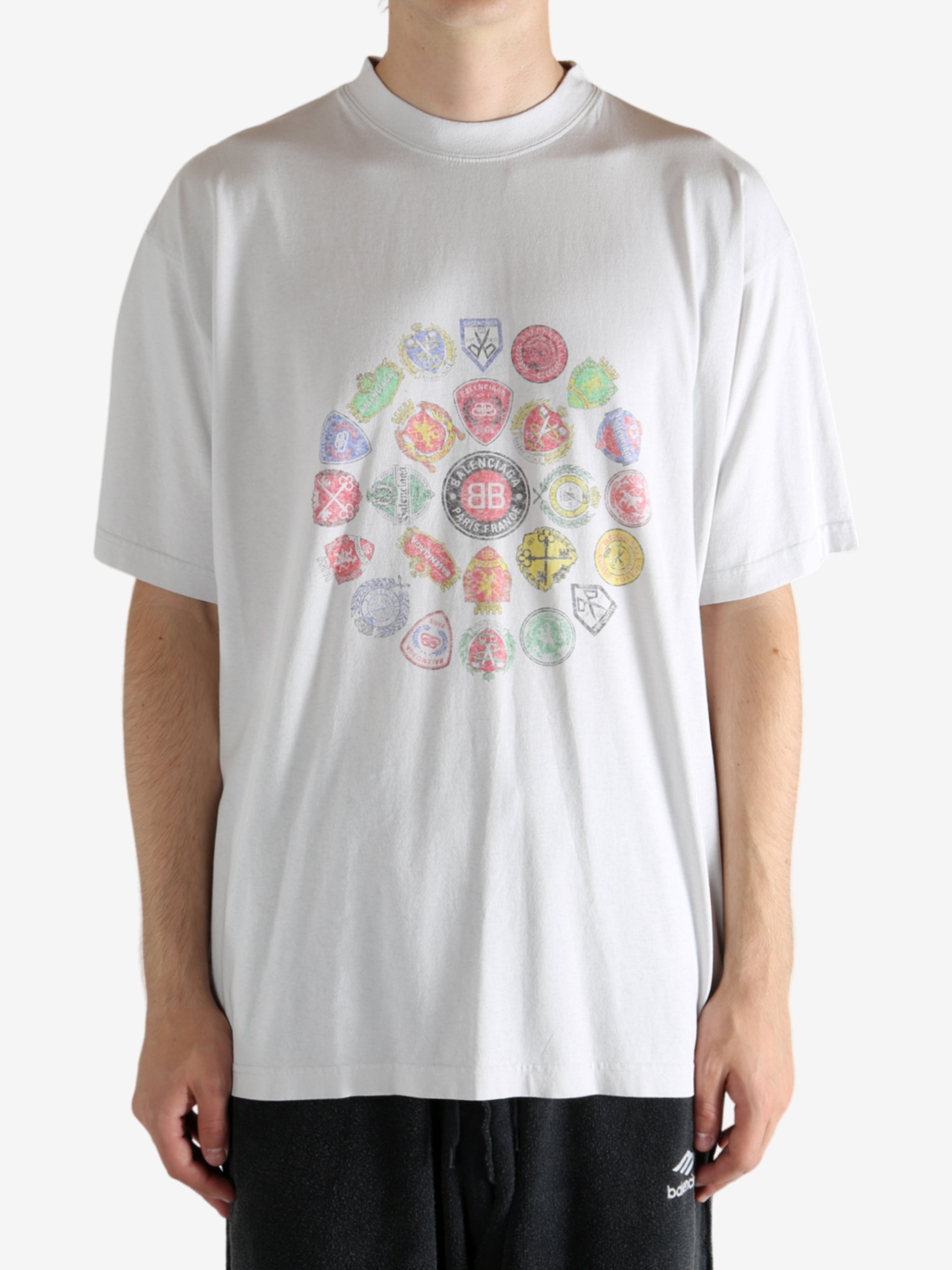 White t-shirt worn by a person, showing the t-shirt's fit