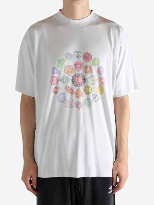 White t-shirt worn by a person, showing the t-shirt's fit