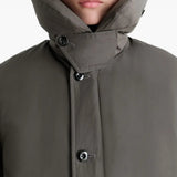 Close up of grey coat, showing texture of the polyamide fabric
