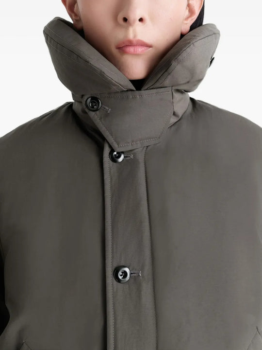 Close up of grey coat, showing texture of the polyamide fabric
