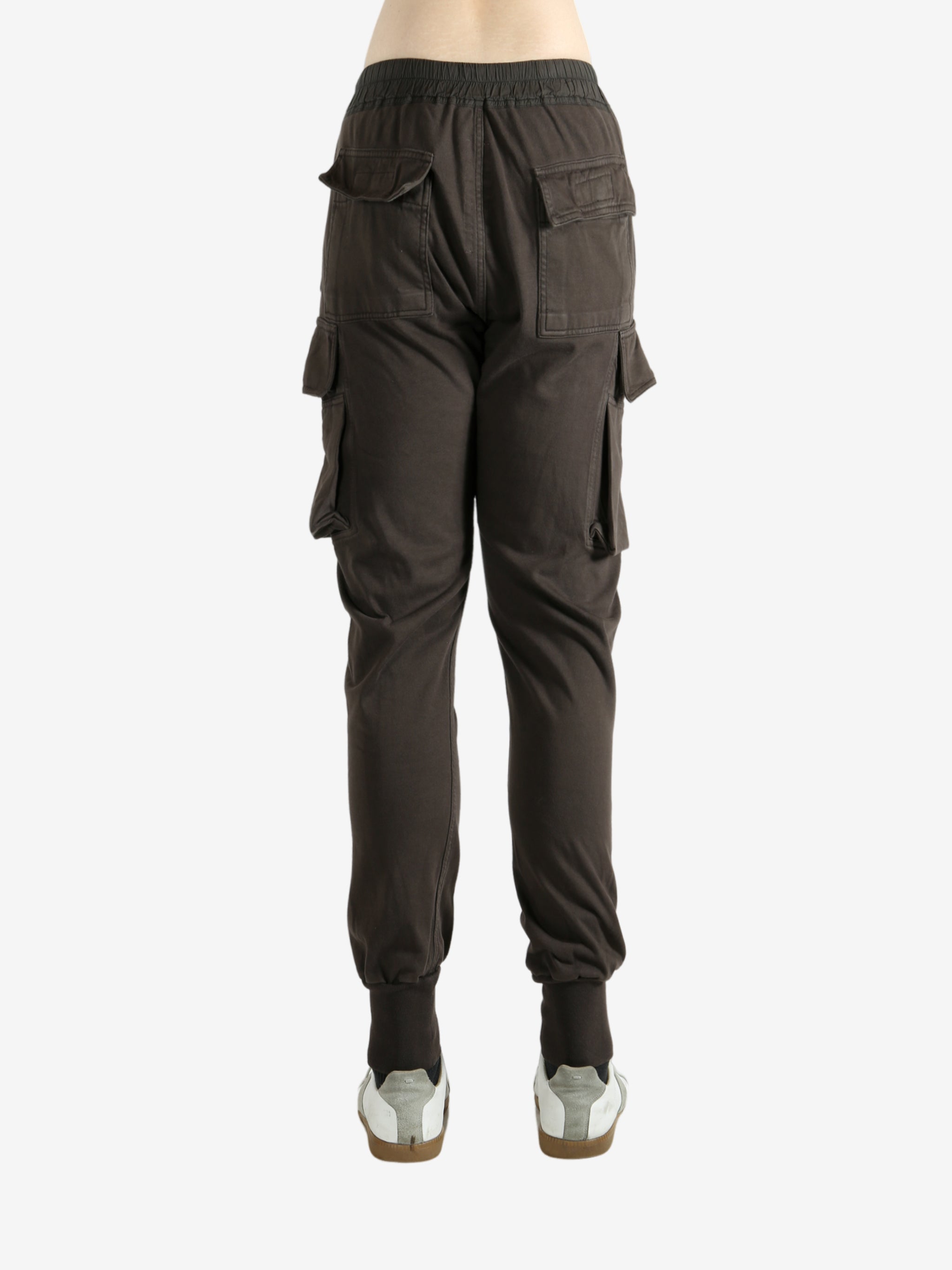 Brown pants worn by a person, showing the pants' fit