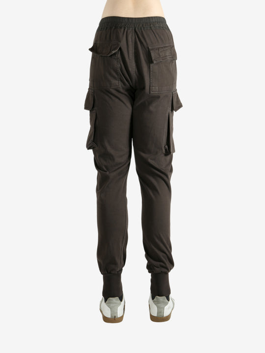 Brown pants worn by a person, showing the pants' fit