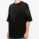 Black t-shirt worn by a person, showing the t-shirt's fit