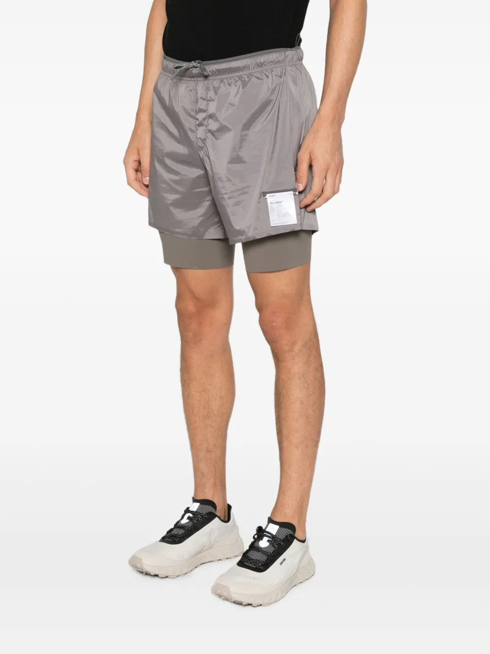 Gray shorts worn by a person, showing the shorts fit