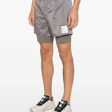 Gray shorts worn by a person, showing the shorts fit