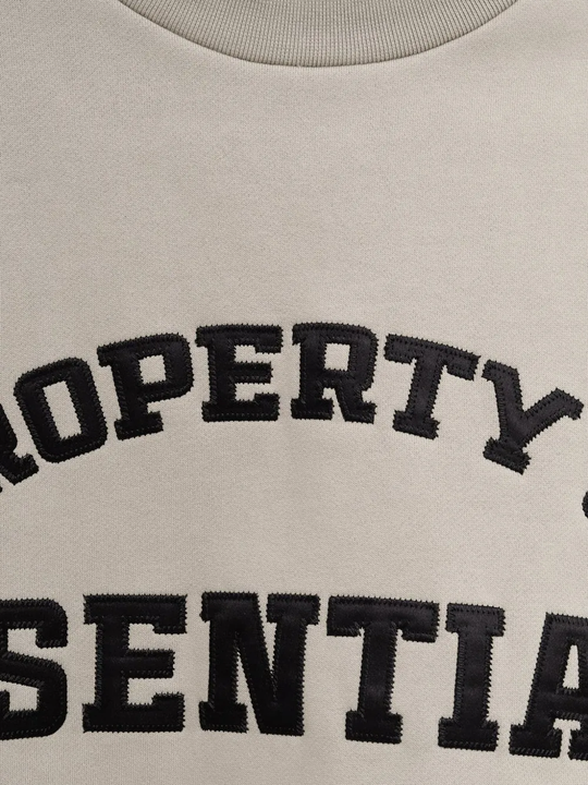 Close up of  Tan sweat-hoodies, showing texture of the cotton and polyester fabric