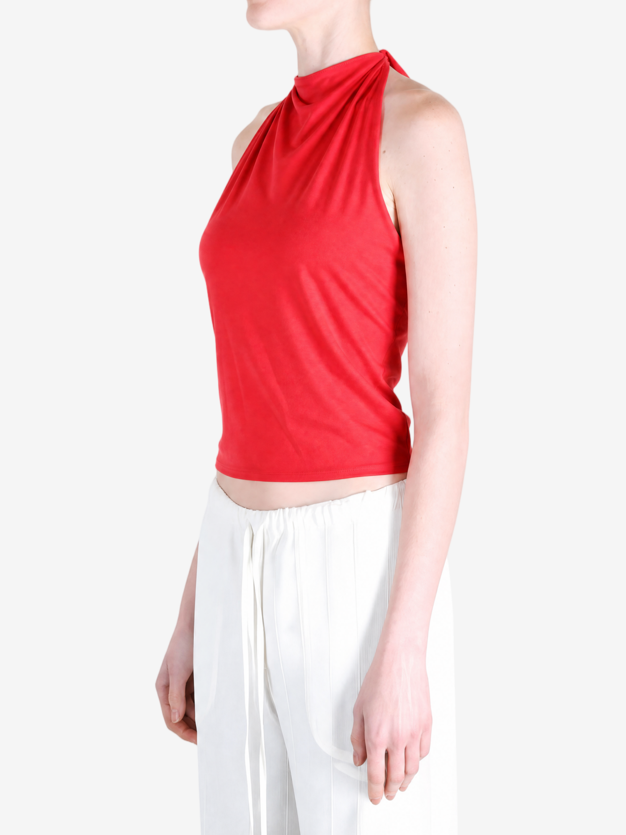 Red top worn by a person, showing the top fit