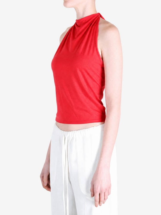 Red top worn by a person, showing the top fit