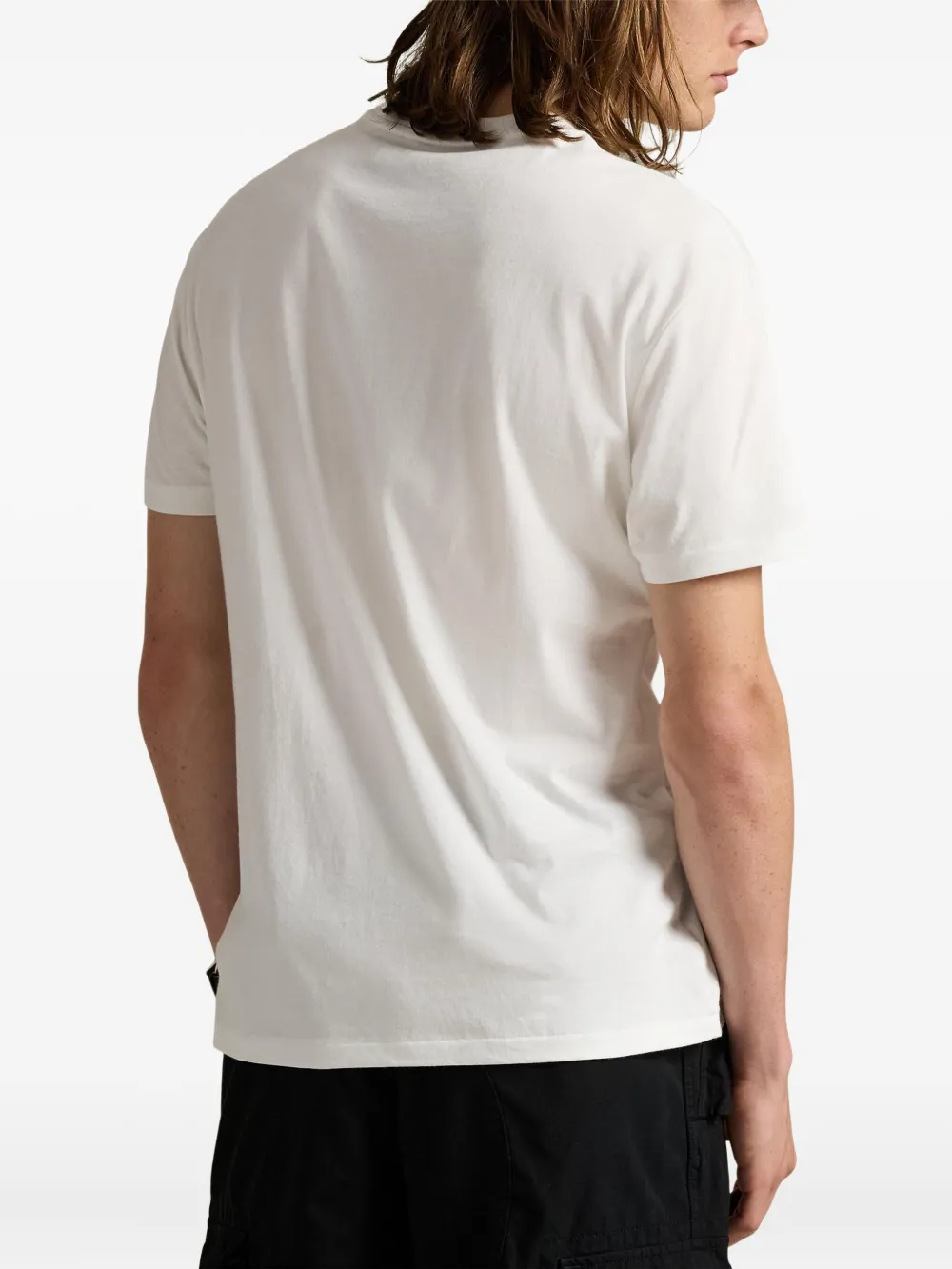 white t-shirts worn by a person,showing the t-shirts fit