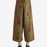 Tan pants worn by a person, showing the pants' fit