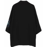 Black coat, back view showing relaxed fit