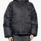 Black jacket worn by a person, showing the jacket's fit