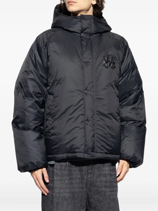 Black jacket worn by a person, showing the jacket's fit