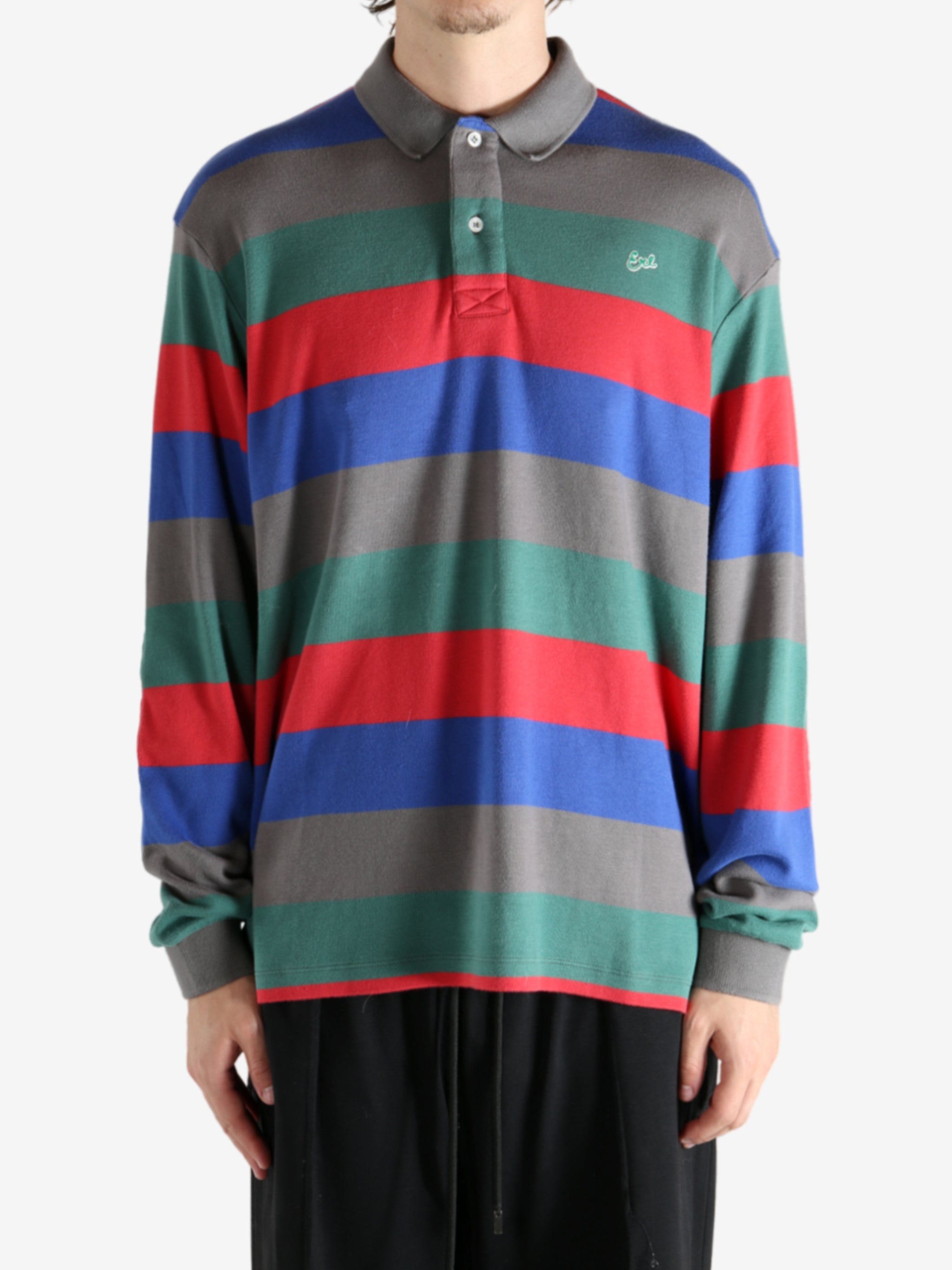 Grey shirt worn by a person, showing the shirt's fit