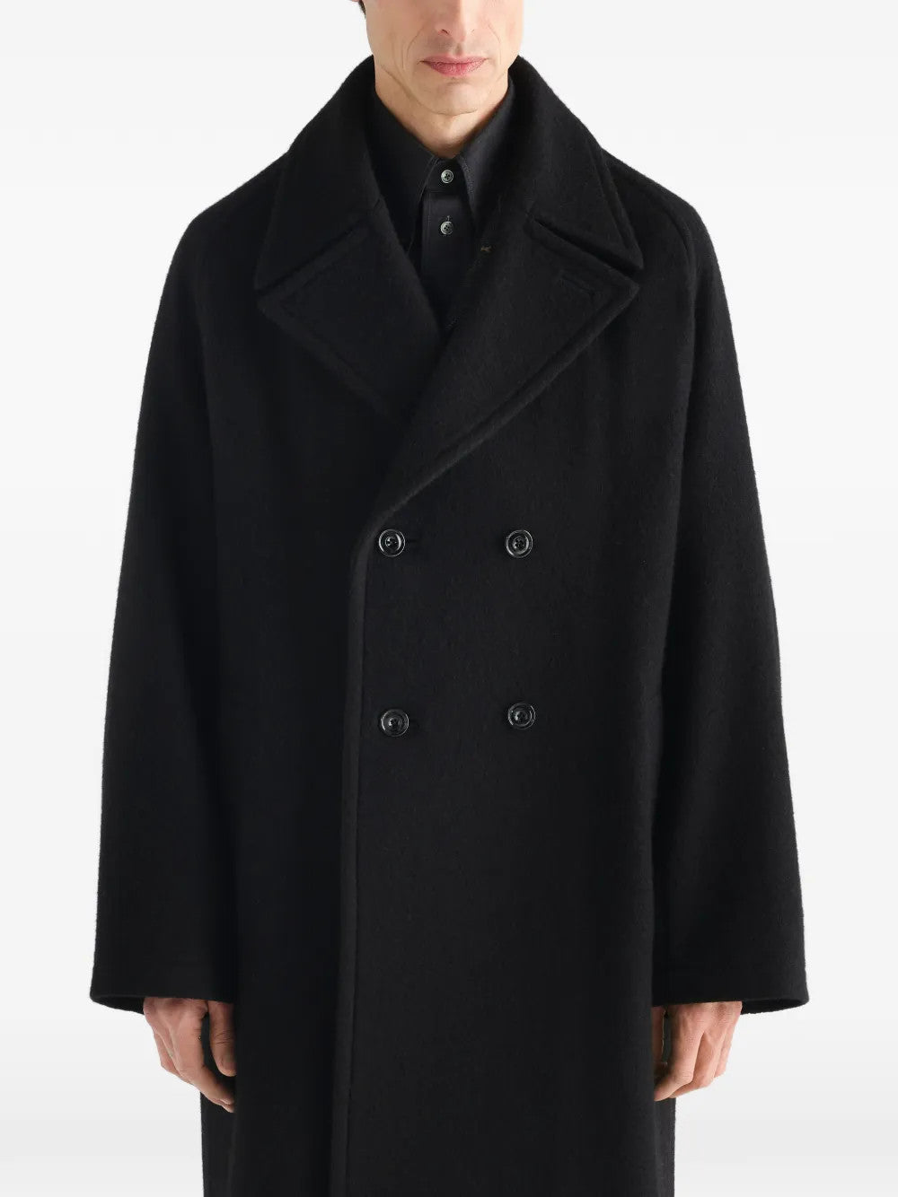 Black jacket worn by a person, showing the jacket fit