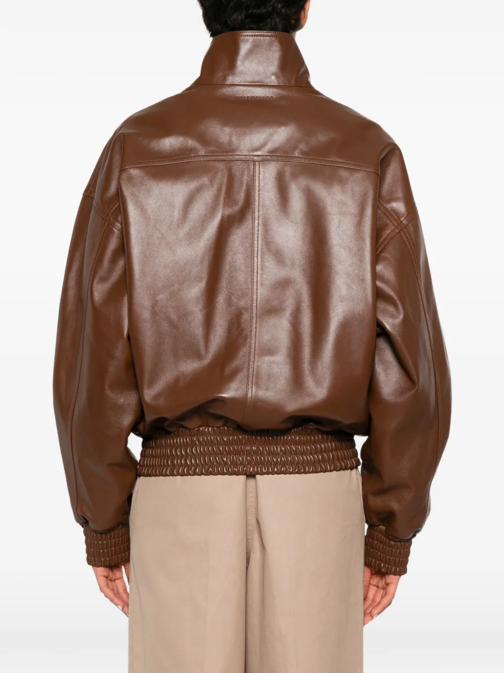 Brown jacket worn by a person, showing the jacket fit