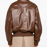 Brown jacket worn by a person, showing the jacket fit