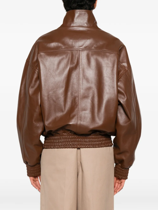 Brown jacket worn by a person, showing the jacket fit