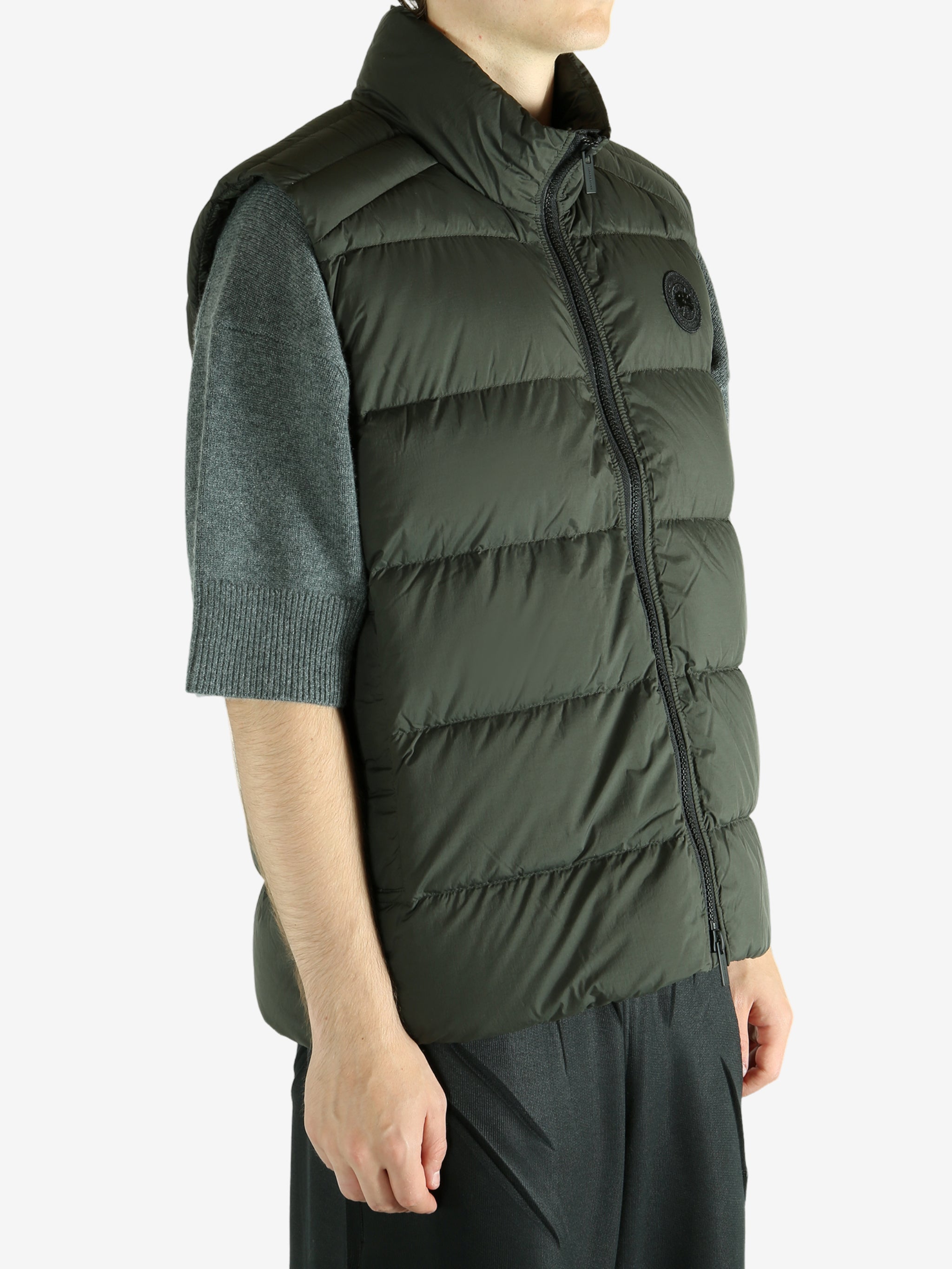 Green vest worn by a person, showing the vest's fit