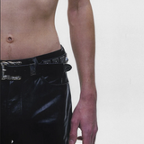 Black accessories worn by a person, showing the accessories fit