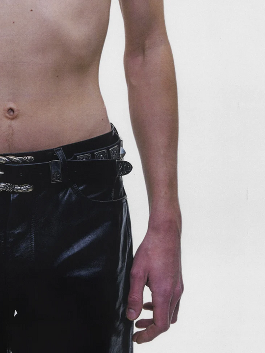 Black accessories worn by a person, showing the accessories fit