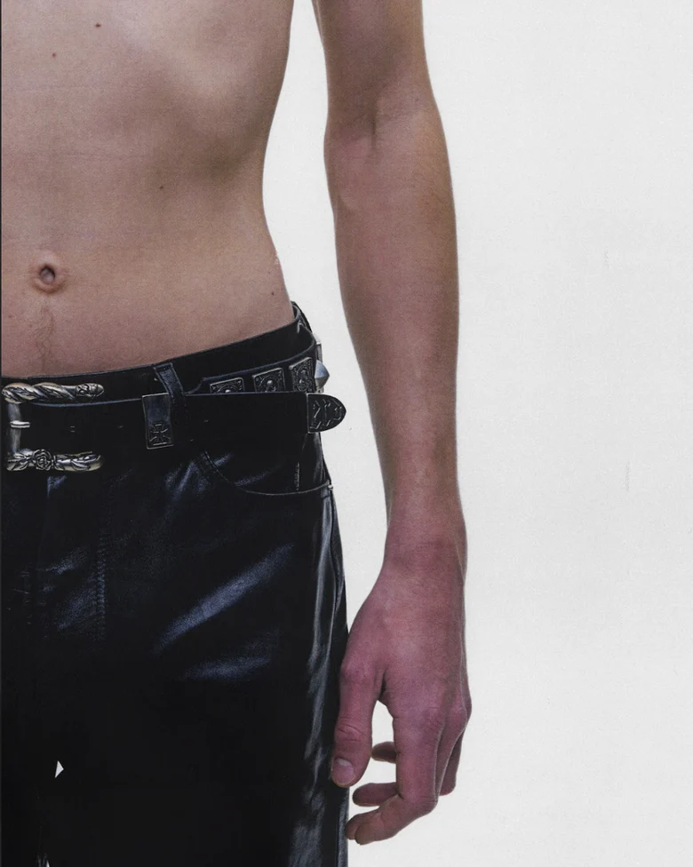 Black accessories worn by a person, showing the accessories fit