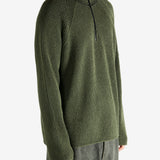 Green shirt worn by a person, showing the shirt's fit