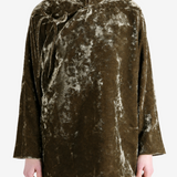 Green jacket worn by a person, showing the jacket fit