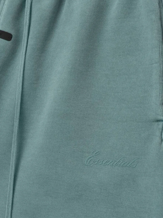 Close up of blue pants, showing texture of the cotton fabric